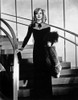 Ginger Rogers descending a staircase wearing an evening dress Photo Print - Item # VARCEL687200