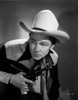 Roy Rogers in Cowboy Attire Holding a Revolver Photo Print - Item # VARCEL687255