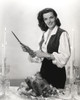 Jane Russell sharpening a knife on Thanksgiving Photo Print - Item # VARCEL687403