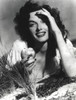 Jane Russell holding an apple Photo Print - Item # VARCEL687421