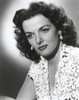Jane Russell Portrait in White V-Neck Floral Lace Dress with Dangling Pearl Earrings in White Background Photo Print - Item # VARCEL687495