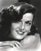 Jane Russell Close Up Portrait in Whit Silk Dress and Pearl Earring with Left Hand Touching the Left Shoulder Photo Print - Item # VARCEL687522