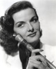 Jane Russell Portrait in White Suit Dress and Black Underclothes with Right Hand Holding a Wooden Baton Photo Print - Item # VARCEL687518