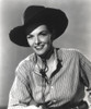 Jane Russell Posed in Stripe Long Sleeve Shirt and Black Cowboy Hat in White Background Photo Print - Item # VARCEL687536