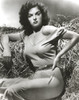 Jane Russell in a hay bale Photo Print - Item # VARCEL687554