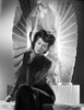 Rosalind Russell Seated on Chair in Black Dress Photo Print - Item # VARCEL687602