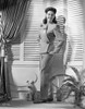 Rosalind Russell smiling with Hands in Pocket Photo Print - Item # VARCEL687617