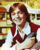 David Cassidy smiling in Red Vest with Guitar Photo Print - Item # VARCEL687987