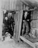 A film still of Charlie Chaplin hiding with a gun Photo Print - Item # VARCEL688112