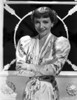 Claudette Colbert smiling in Floral Dress with Arm's Cross Photo Print - Item # VARCEL688492