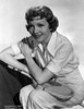 Claudette Colbert Posed in White Shirt with Tennis Racket Photo Print - Item # VARCEL688500