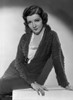 Claudette Colbert sitting in Black Dress Photo Print - Item # VARCEL688527