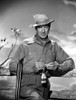 Gary Cooper leaning on Fence in Western Outfit Photo Print - Item # VARCEL688651