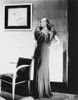 Joan Crawford wearing a gown with feather collar Photo Print - Item # VARCEL688793