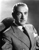 Clifton Webb sitting in Tuxedo with Necktie Photo Print - Item # VARCEL696155