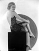 Joyce Compton sitting on a Chair wearing a Backless Dress in a Classic Portrait Photo Print - Item # VARCEL696283
