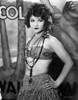 Betty Compson Posed with Hands on the Waist in Tube Bra and Knitted Straw Skirt with Bead Necklaces Photo Print - Item # VARCEL696338