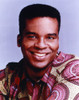 David Grier smiling in Red Shirt Photo Print - Item # VARCEL696365