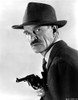 Ian Wolfe wearing a Suit with Hat and Gun Photo Print - Item # VARCEL696465