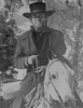 Clint Eastwood Ridding Horse in Black Coat with Hat Photo Print - Item # VARCEL696560