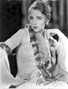 Bebe Daniels Posed Hand on the Waist in Black Pelt Boa and White Long Sleeve Dress Photo Print - Item # VARCEL696610
