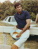 George Hamilton Leaning on a White Fence Photo Print - Item # VARCEL696625