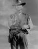 Clint Eastwood Posed in Cowboy Outfit with Pistol Photo Print