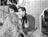 Bebe Daniels Moving Away Her Head to the Man in Floral Mantle Dress Photo Print - Item # VARCEL696665