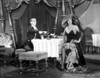 Bebe Daniels Having a Dinner with a Man in Black Strap Dress with Hands Laid on the Waist Photo Print - Item # VARCEL696668