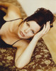 Marcia Harden Lying on Bed in Black Dress Photo Print - Item # VARCEL696679