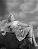 Denise Darcel Reclining on a Rock in Black and White Photo Print - Item # VARCEL696755