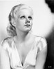 Jean Harlow Portrait in Deep V-Neck Short Sleeve Silk Dress with Eyes Looking Up and Hands on the Lap Photo Print - Item # VARCEL696762