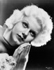 Jean Harlow Portrait in White Fur Coat with Hands Together with Eyes Looking Up in Black Background Photo Print - Item # VARCEL696857