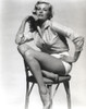 Anita Ekberg sitting on a Chair wearing a Glossy Long Sleeves in a Classic Portrait Photo Print - Item # VARCEL696898