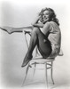 Anita Ekberg sitting in a Chair, One Leg Raised Classic Portrait Photo Print - Item # VARCEL696881