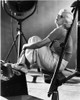 Jean Harlow Seated Knees Bent in Black Shirt and White Skirt Photo Print - Item # VARCEL696990