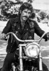 A Portrait Of Sam Elliott Riding A Motorbike Photo Print - Item # VARCEL696991