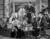 Jean Harlow Scene from a Film sitting on the Chair in White Long Sleeve Shirt and Black scarf Photo Print - Item # VARCEL697017