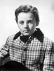Freddie Bartholomew sitting on Side Boat in White Suit Photo Print - Item # VARCEL697034