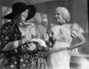 Jean Harlow Scene from a Film standing in Tartan Short Sleeve Linen Dress with Right Hand Holding a Big Spoon Photo Print