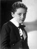 Freddie Bartholomew sitting on Chair With Leg's Cross Photo Print - Item # VARCEL697038