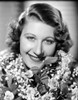 Joan Davis smiling while Surrounded by Flowers Photo Print - Item # VARCEL697115