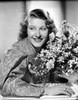 Joan Davis smiling in A Portrait While Holding A Bouquet of Flowers in Black and White Photo Print - Item # VARCEL697123