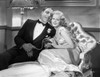 Jean Harlow Scene from a Film Seated on the Couch Photo Print - Item # VARCEL697205