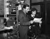 John Boles and a woman reading a letter Photo Print - Item # VARCEL697339