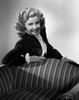 Gloria DeHaven Leaning on A Chair in Black and White Photo Print - Item # VARCEL697488