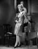 Gloria DeHaven Leaning On A Table in Formal Dress in Black and White Photo Print - Item # VARCEL697550