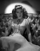 Gloria DeHaven sitting On A Couch in Gown in Black and White Photo Print - Item # VARCEL697529
