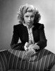 Gloria DeHaven Looking Serious Leaning On A Chair in Formal Dress in Black and White Photo Print - Item # VARCEL697553