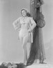 Susan Hayward smiling and Hands on Waist in Trench Coat and White Bikini Photo Print - Item # VARCEL697557